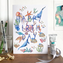 Load image into Gallery viewer, Happy birthday card with sea creatures standing on a mantlepiece