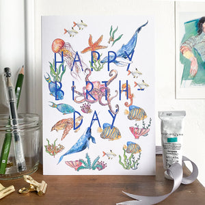 Happy birthday card with sea creatures standing on a mantlepiece